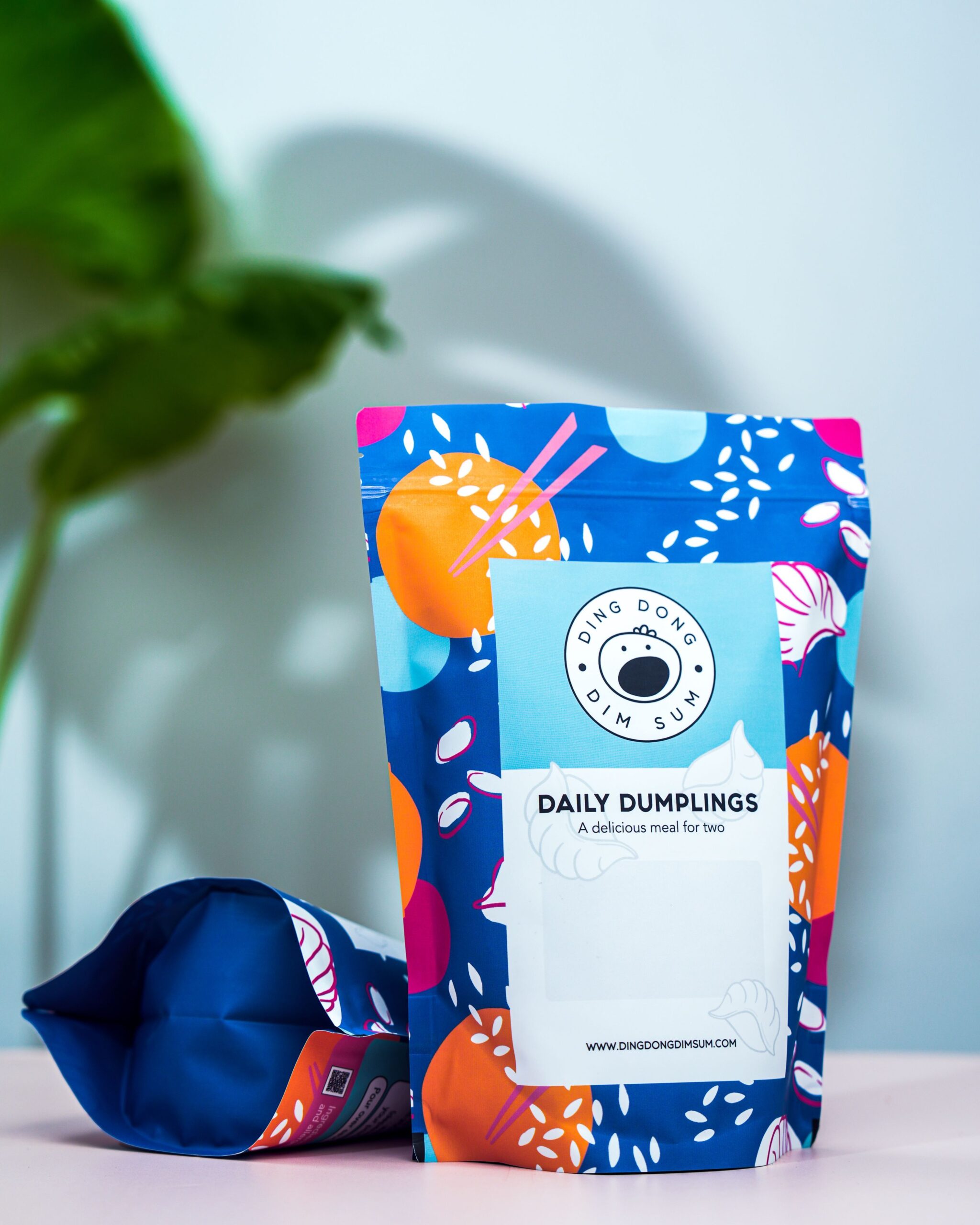 Vibrant packaging of Daily Dumplings by Ding Dong Dim Sum, perfect for two.