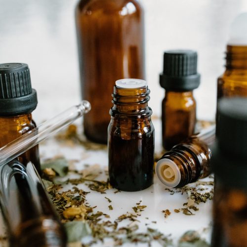 A close-up of amber bottles with essential oils, showcasing natural healing properties.